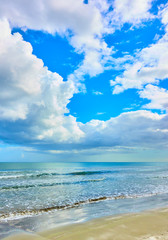 Sandy beach and white clouds