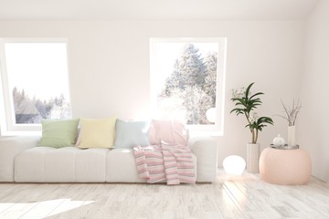 White stylish minimalist room with sofa and winter landscape in window. Scandinavian interior design. 3D illustration