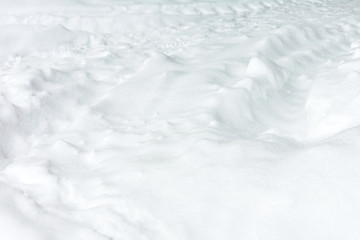 Photo of freshly fallen snow on which the car passed and left a trail.