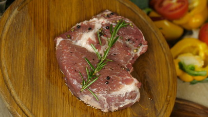 marinated meat twists the planking around its axis, a juicy piece of beef or veal marinated with dry spices and fresh twig branch