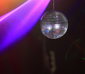 hand DJ holds disco ball. photo with copy space