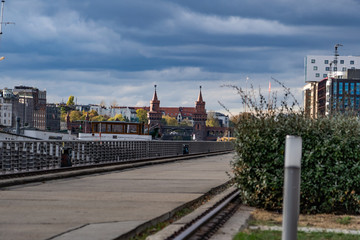 historical Oberbaum bridge (Oberbaumbruecke) and the river Spree in Berlin, Germany, Europe, vintage filtered style