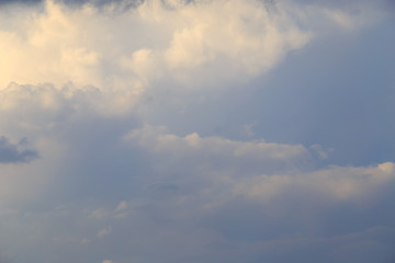 Clouds after rain before sunset as a background