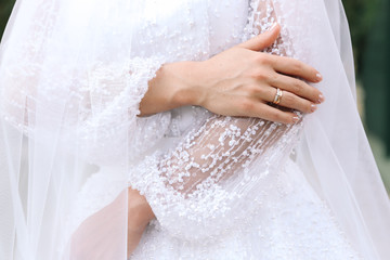 Woman showing wedding ring on her hand. Wedding day.