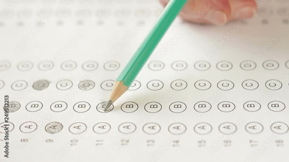 Wall mural filling out answers on a multiple choice test close up