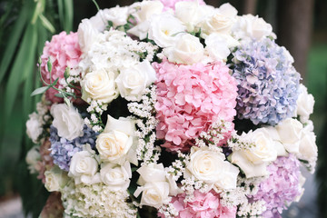 Wedding arch decorated with white flowers and flower compositions of pink and white flowers. Hydrangea.