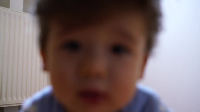 Funny toddler is happy in the room