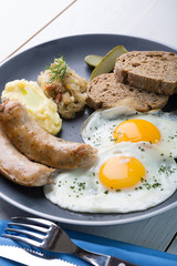German breakfast on a grey plate