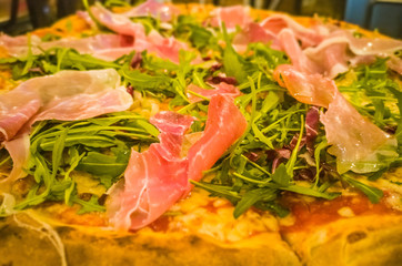 Pizza with prosciutto ham and fresh vegetables