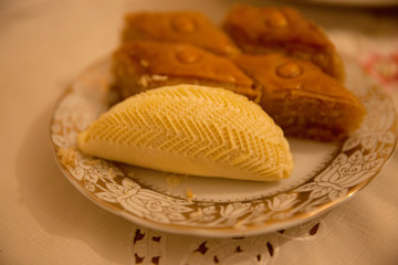 Spring holiday Novruz in Azerbaijan. Easter and traditional sweets baklava, shekerbura on wooden table