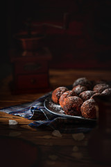 Chocolate truffles on a dark plate