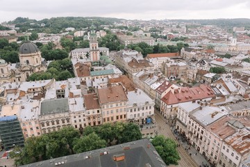 Naklejka premium Top view from of the city hall on houses in Lviv, Ukraine. Lviv bird's-eye view. Lviv old town from above.