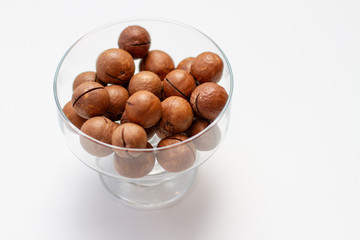 Macadamia nuts on white background