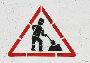 Funny road construction traffic sign made with stencil very unpropotional figure