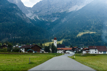 Obraz premium village road in the mountains, Alps