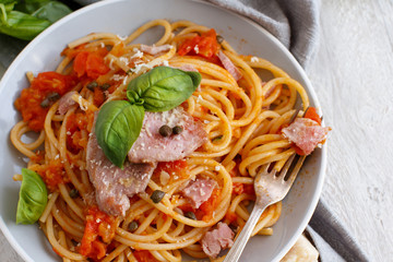 Pasta with chunks of fresh tuna, tomato and capers