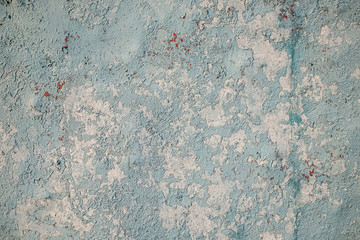 Old metal surface with blue peeling paint