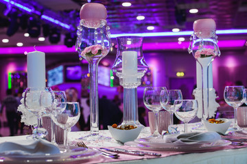 Elegant candlelight dinner table by night