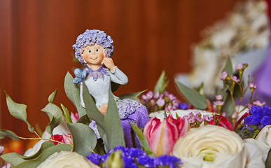 Statuette of flower fairy inside birthday bouquet