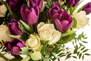 White roses and purple tulips in a nice bouquet