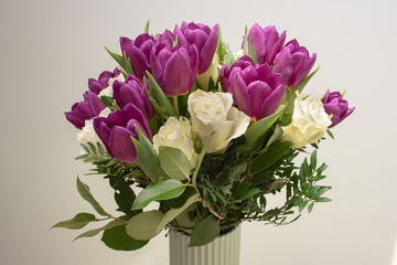 White roses and purple tulips in a nice bouquet