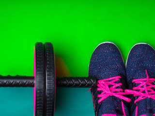 sneakers on green background. Fitness background. Main sport trend concept.