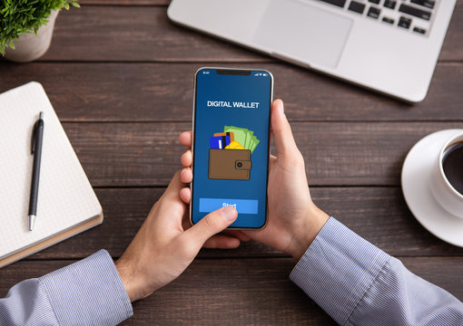 Man Holding Smartphone With Digital Wallet Application