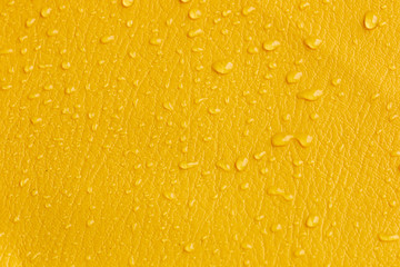 bright yellow leather skin texture with water drops for beauty background use 