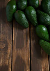 avocado on dark wooden surface