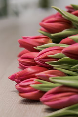 bouquet of red tulips on the table