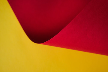 Abstraction of a design paper red and yellow. Empty space on monochrome paper.