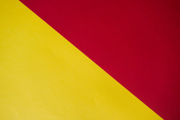 Abstraction of a design paper red and yellow. Empty space on monochrome paper.