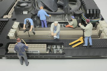 a Worker team of engineers repairing compute