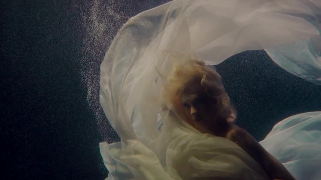 Mermaid girl under the water.