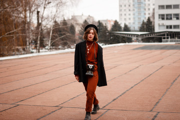 Full length portrait of fashion girl photographer