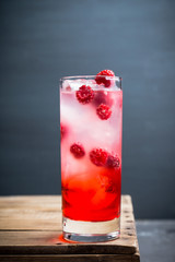 Sweet raspberry Tom collins cocktail. Selective focus. Shallow depth of field.