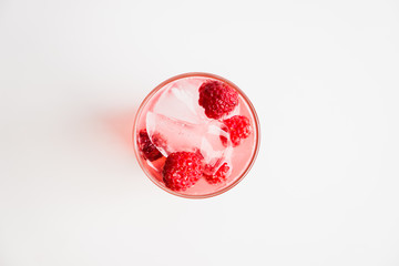 Sweet raspberry Tom collins cocktail. Selective focus. Shallow depth of field.