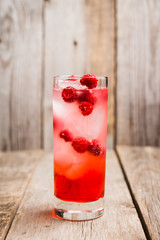 Sweet raspberry Tom collins cocktail. Selective focus. Shallow depth of field.