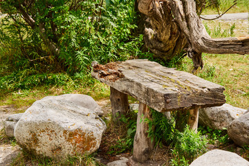 old table made of solid wood with stones, picnic area