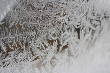Winter background. Frost with crystal ice on a window