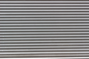 Obraz premium Rolling steel door in gray color. Saara, Rio de Janeiro, Brazil. 2019