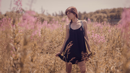 Portrait of a girl on a summer background