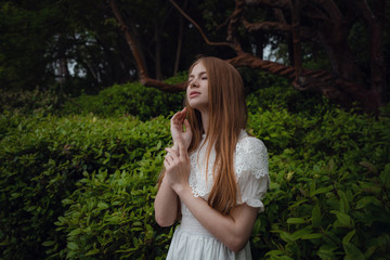 Attractive young woman enjoying her time outside in park