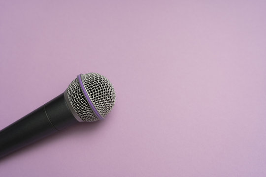 Vocal Microphone Laying On The Purple Surface