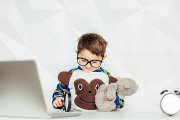 education, technology and learning concept - happy boy with pc computer and notebook learning at home - Image