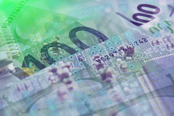 silhouette of a computer board against the background of a banknote euro, double exposure