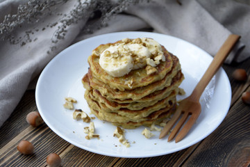 Stack of oatmeal pancake with banana, nuts and honey Healthy Breakfast	