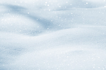 Fresh snow background texture. Winter background with snowflakes and snow mounds. Snow lumps.