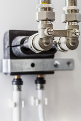 Fototapeta na wymiar ceramic-metal pipes, couplings and fittings. Plumbing, fixing pipes and fittings for connection of water or gas systems