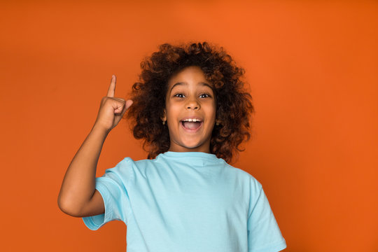 African-american child girl having idea, raising finger